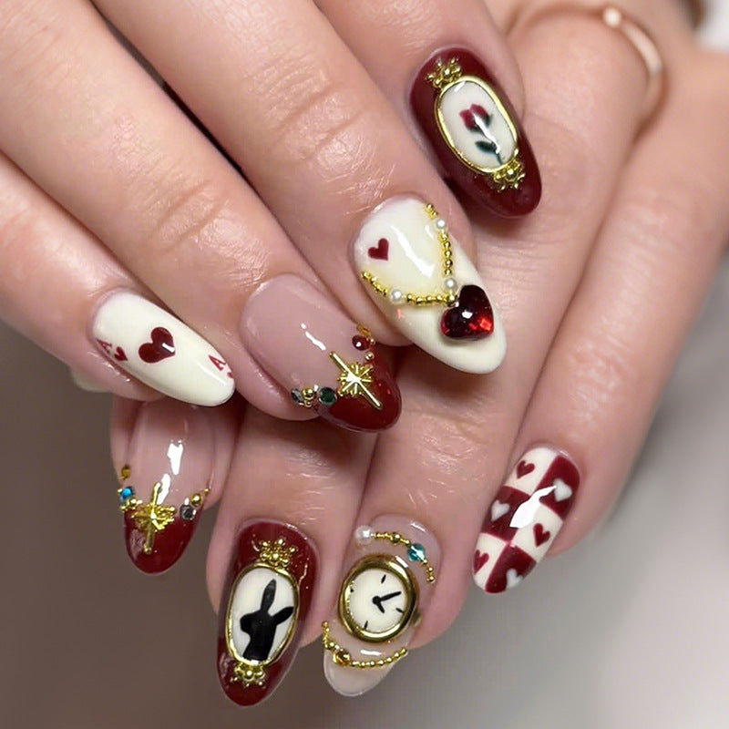 Künstlerisches Press-On-Nagelset mit kreativen Herz- und Uhrendesigns Brehn