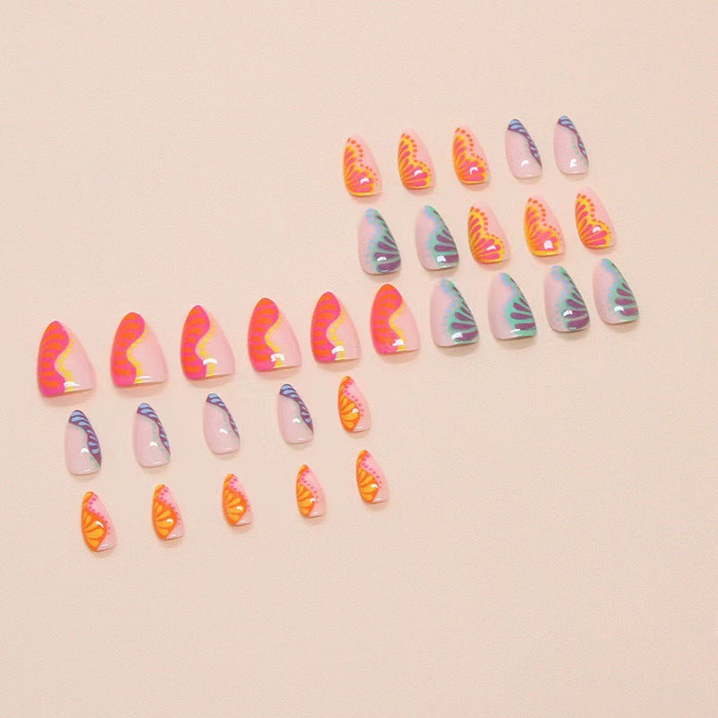 Kunstnagelset mit buntem Farbverlauf und kreativen Designs Brehn