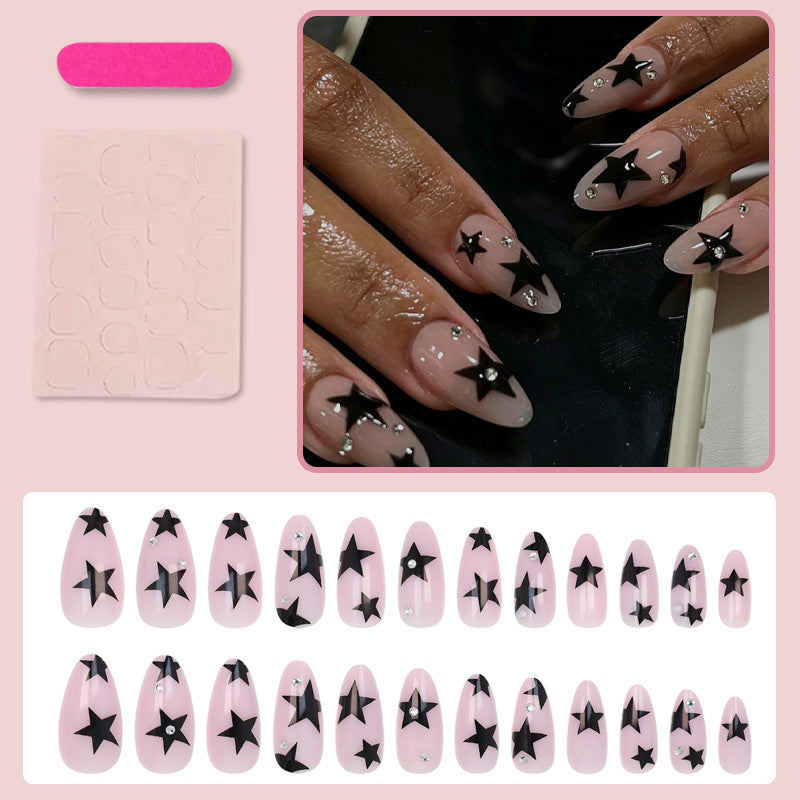 Kunstnagelset mit glamourösen Sternen und funkelnden Akzenten Brehn