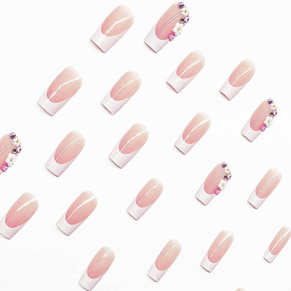 Kunstnagelset mit eleganten Blumendekoren und transparentem Finish Brehn