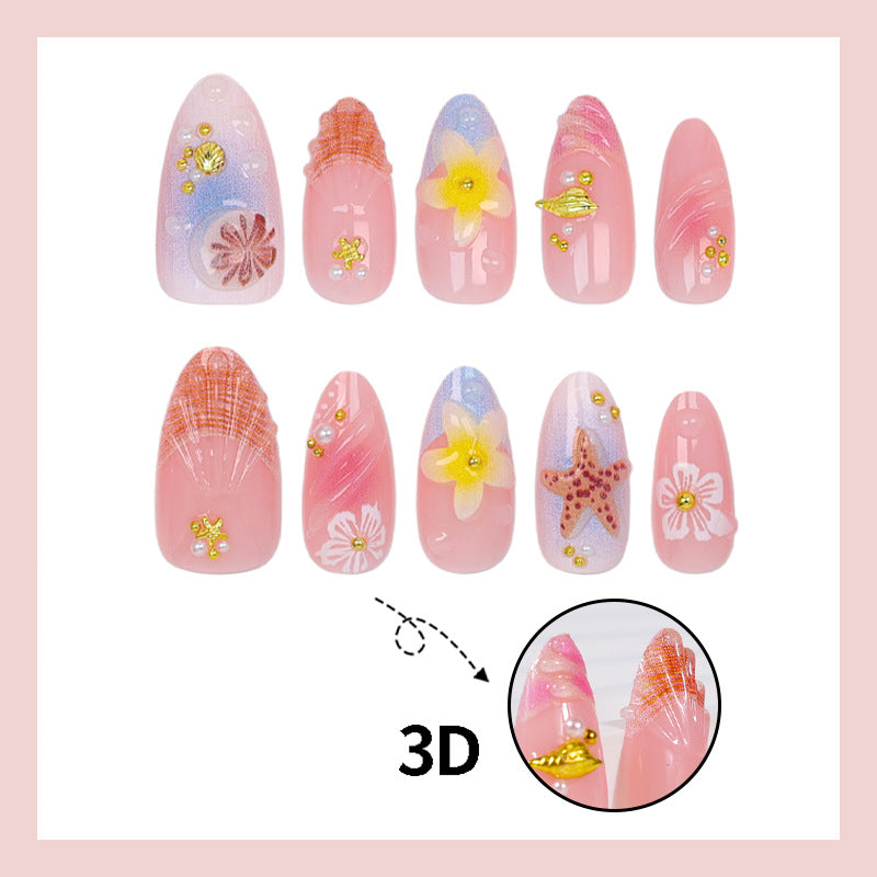 Kunstnagelset mit maritimen Designs und glitzernden Akzenten Brehn
