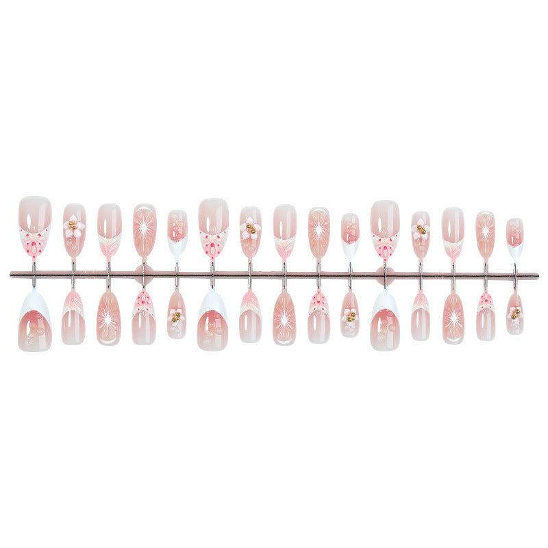Kreatives Kunstnagelset mit floralen Akzenten und Glitzerverzierungen Brehn