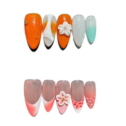 Künstlerisches Press-On Nagelset mit floralen und gradienten Akzenten