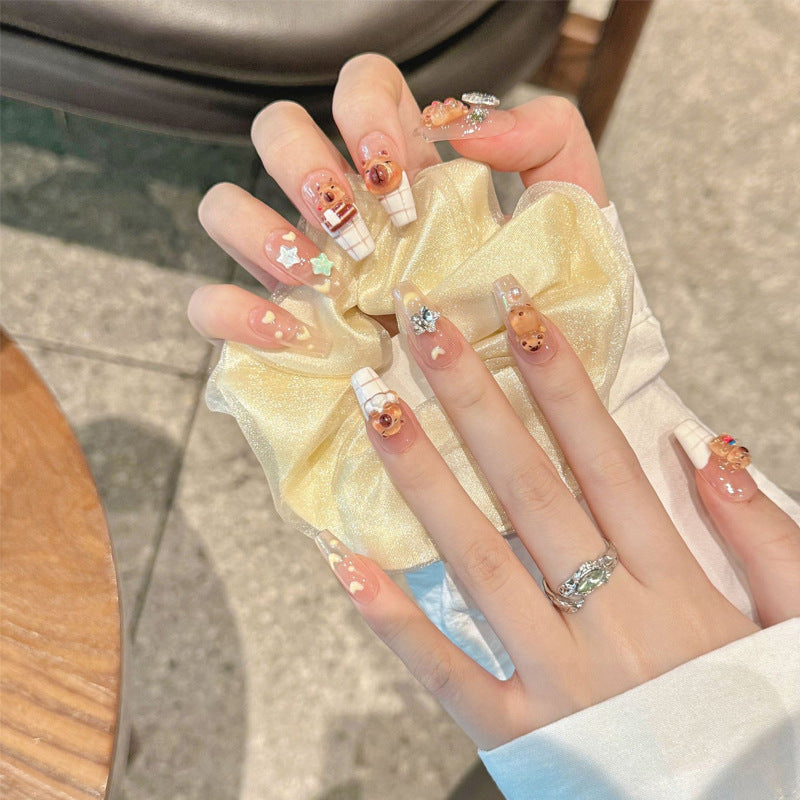 Kunstnagelset mit charmantem Tierdesign und funkelnden Kristallverzierungen Brehn