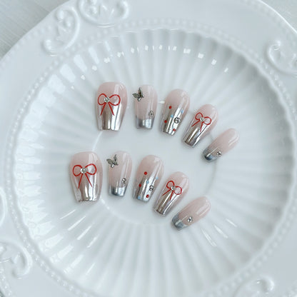 Künstlerisches Press-On Nagelkunstset mit Schleifen- und Edelstein-Details