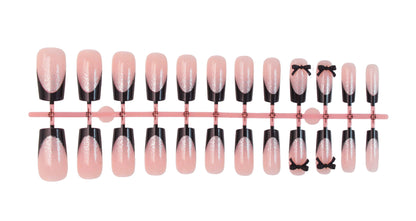 Kunstnagelset mit eleganten Glitzerakzenten und Schleifendetails Brehn