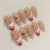 Elegantes floral und Goldakzent Press-On Nagelset Brehn