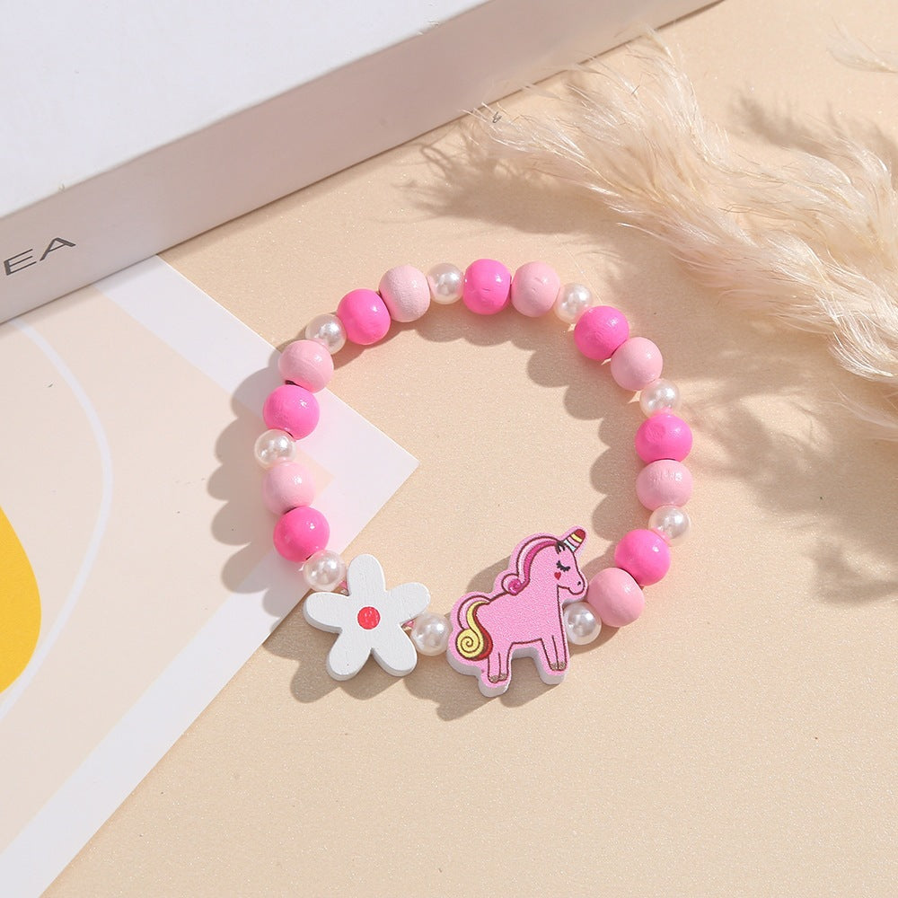 Verspieltes Kinderarmband mit Einhorn- und Blumenmotiv Brehn