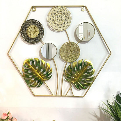 Dekorative Metallwandkunst mit tropischem Blatt- und Spiegeldesign Brehn