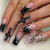 Künstlerisches Lang-Press-On-Nageldesign-Set mit Kreuzakzenten Brehn