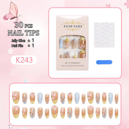 Kunstnagelset mit Floral-Motiven und Glitzerakzenten Brehn