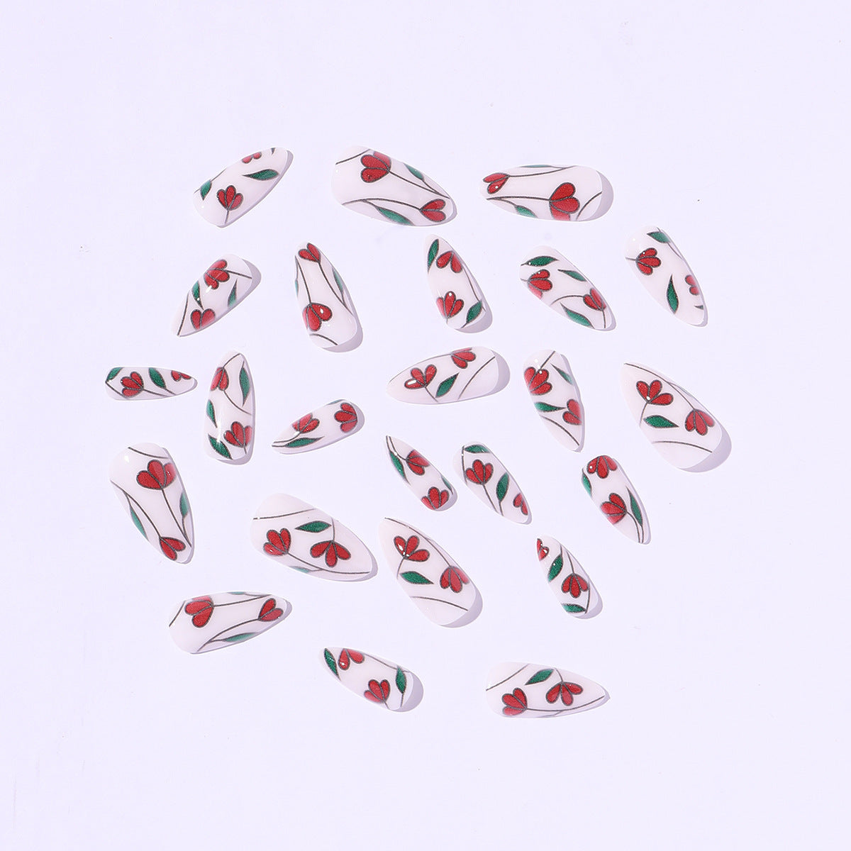 Kunstnagelset mit floralen Akzenten und Glitzer Brehn