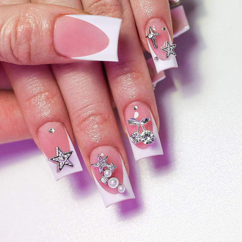 Kunstnagelset mit dekorativen Blüten- und Glitzermotiven Brehn