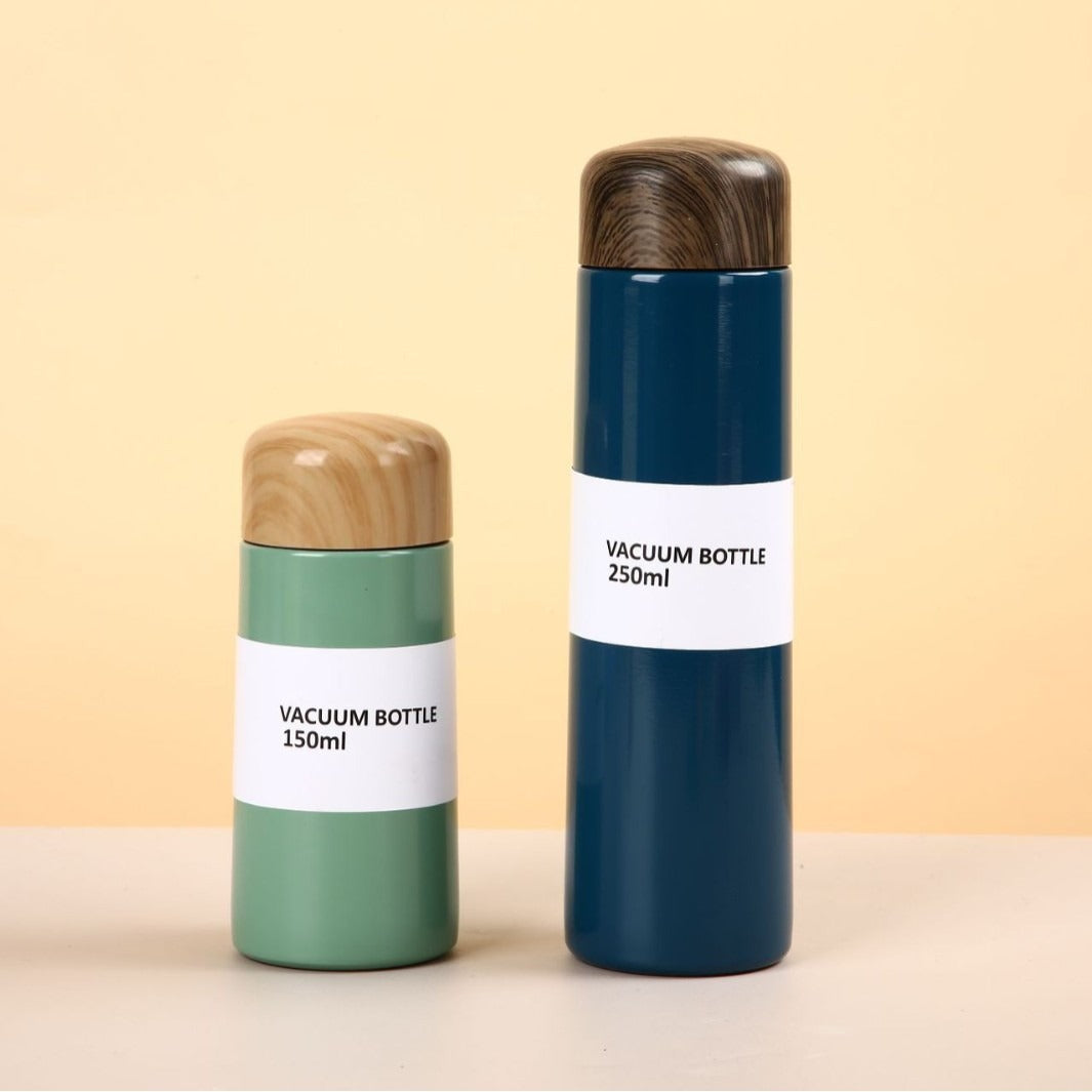 Damen vakuumisolierte Wasserflasche mit innovativem Holzdeckel Brehn