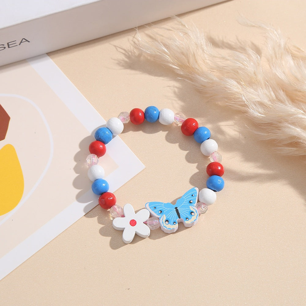 Verspieltes Armband mit Herz- und Schmetterlings-Anhängern Brehn