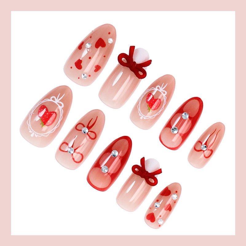Kunstnagelset mit niedlichen Herz- und Schleifenmotiven Brehn