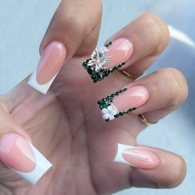 Kunstnagelset mit eleganten Strassverzierungen und floralem Design Brehn