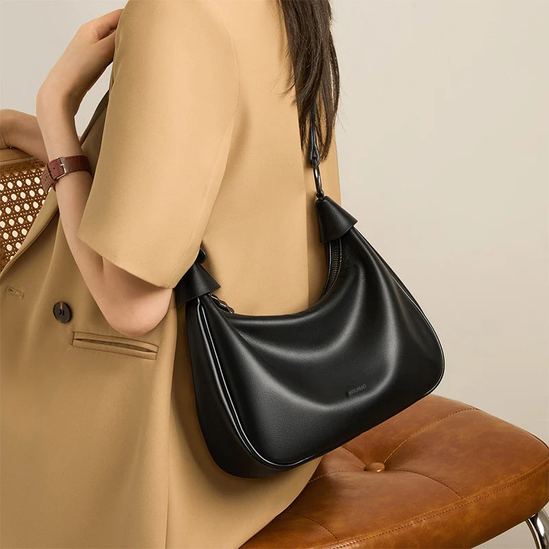 Stylische geschwungene Schultertasche Brehn