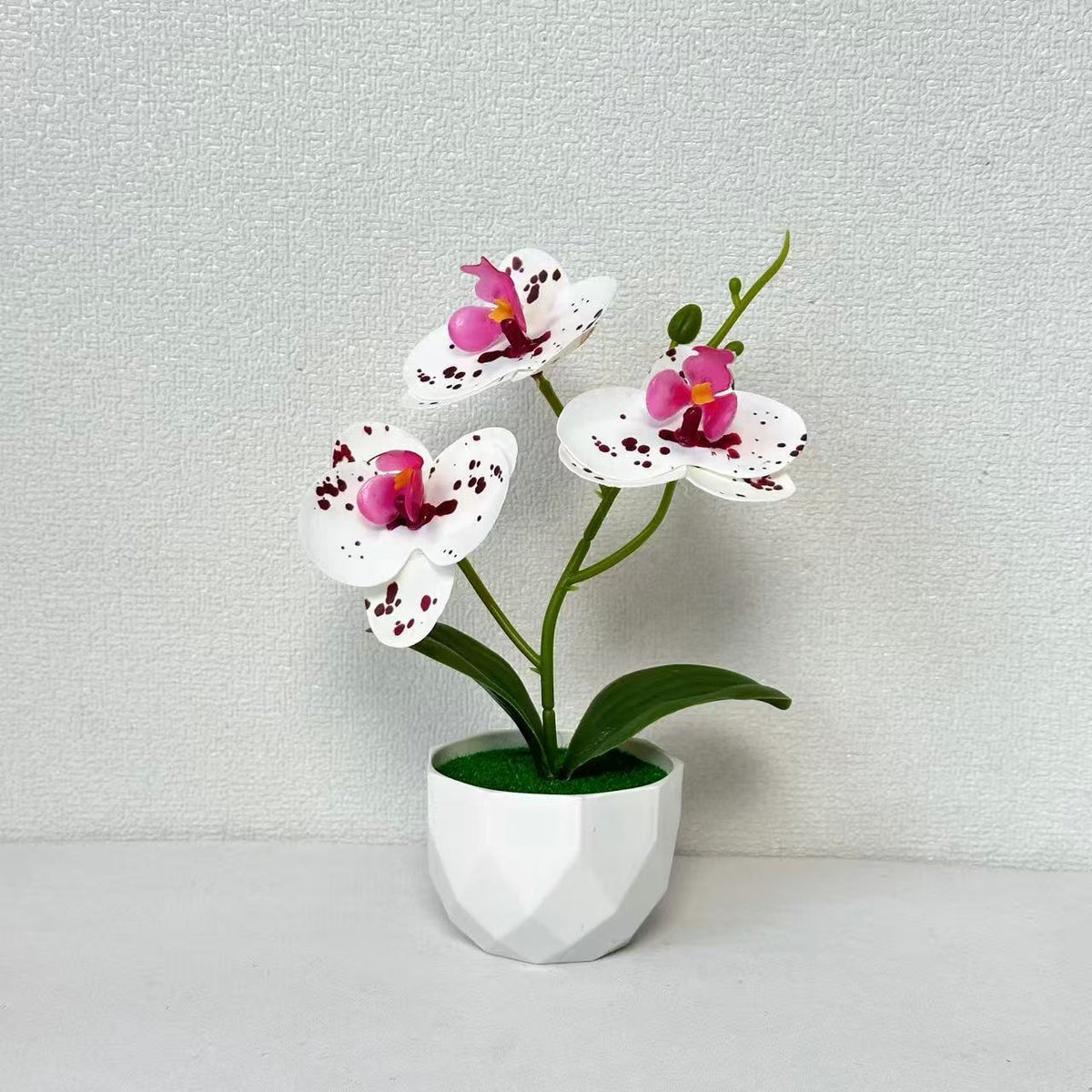 Künstliche Orchideenarrangement für dekorative Innendekoration