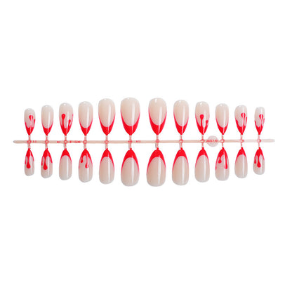 Kunstnagelset mit kreativem Rot-weißem Lackdesign Brehn
