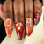 Kunstvoller Nagelkunst mit Perlen und Schmetterlingsdetails Brehn