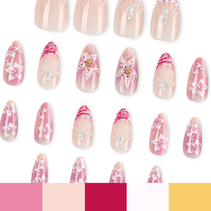 Kunstvolle Nagelverlängerungen mit floralen und glitzernden Akzenten Brehn