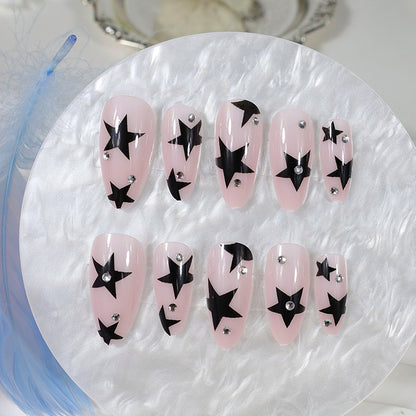 Kunstnagelset mit glamourösen Sternen und funkelnden Akzenten Brehn