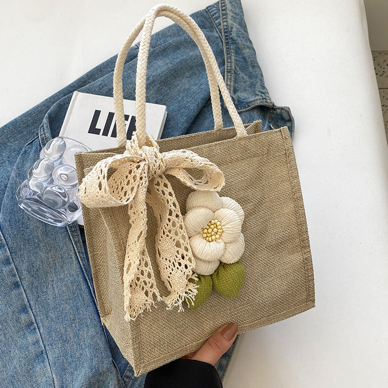 Blumenverzierte Tasche