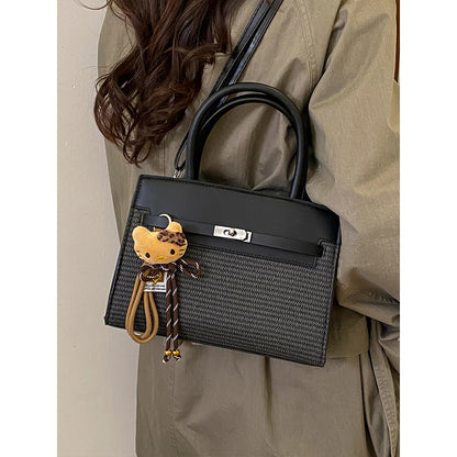 Elegante gewebte Handtasche mit abnehmbarem Schulterriemen