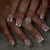 Dekorativer Langer Press-On Nagelset Brehn