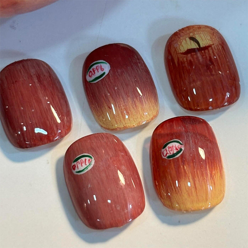 Künstlerisches Press-on-Nail-Set mit einzigartigen Apfel-Designs Brehn