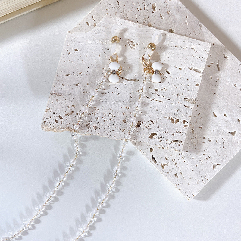 Elegante Ohrringe mit Perlen und Blütenanhängern Brehn