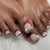 Kunstnagelset mit zarten Blütenmotiven und Glanz Brehn