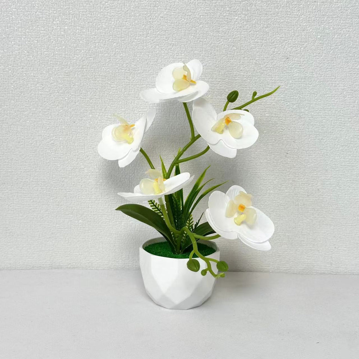 Künstliche Orchideenblumenarrangement für die Innendekoration