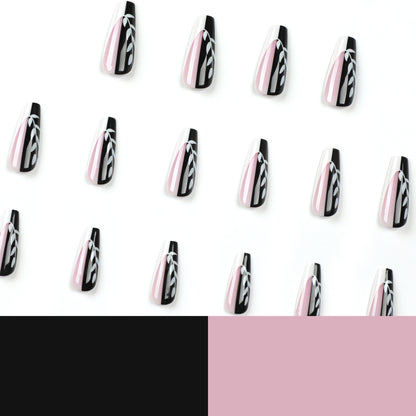 Kunstvolle Nagelverlängerungen im eleganten Schwarz-Weiß-Design Brehn