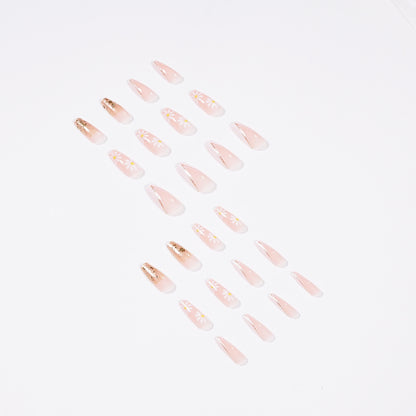 Kunstvolle Nagelverlängerungen mit floralen Designs und Glitzerakzenten Brehn