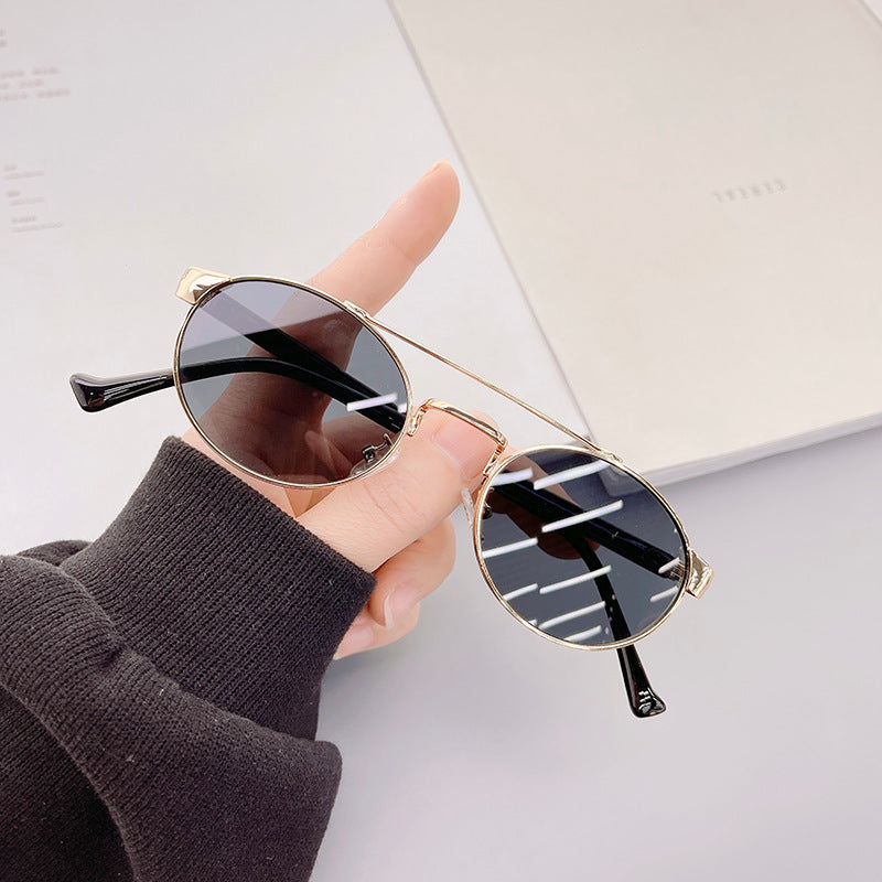 Damen modische Sonnenbrille im stilvollen runden Design mit goldenen Akzenten Brehn