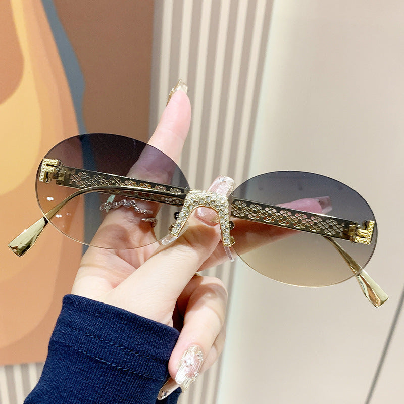 Damen Sonnenbrille mit glitzerndem Rahmen und ovalen Gläsern Brehn