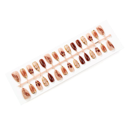 Elegantes dekoratives Press-On-Nail-Art-Set mit goldenen Akzenten Brehn