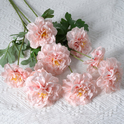 Künstliches Blumenarrangement mit Ringelblumen