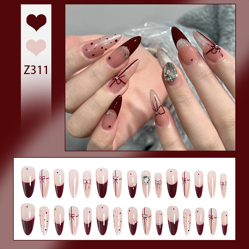 Kunstnagelset mit eleganten Schleifen- und Glitzer-Details Brehn