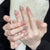 Kunstnagelset mit elegantem Perl- und Glitzerdesign Brehn