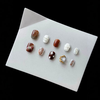 Künstlerisches Press-On-Nagelset mit einzigartigen Texturen und Designs