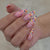Kunstnagelset mit bunten Glitzerpunkten und eleganten Spitzen Brehn
