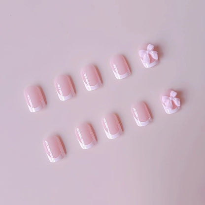 Kunstnagelset mit eleganten Spitzen und 3D Schleifenverzierungen Brehn
