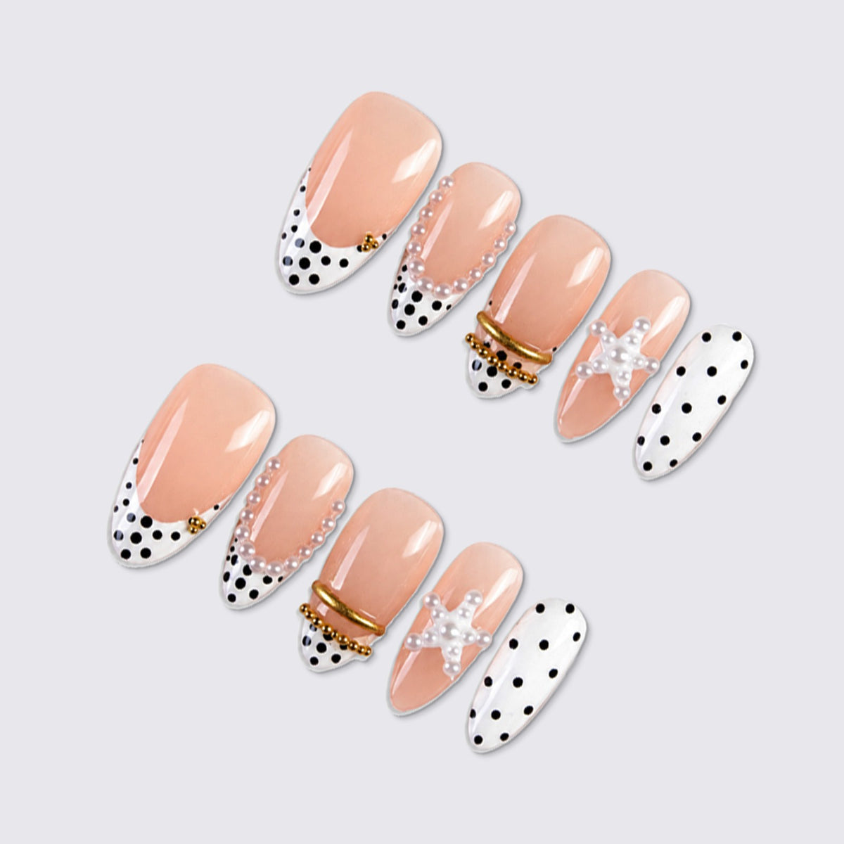 Kunstnagelset mit eleganten Perlen- und Punkten-Akzenten Brehn