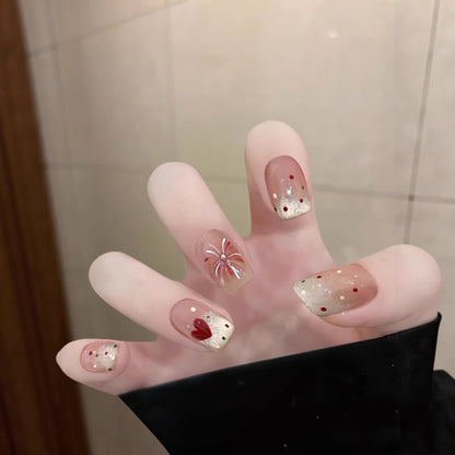 Künstlerisches Press-On Nagel-Kunstset mit floralen und Glitzerakzenten