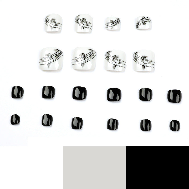 Kunstvolle Fußnagelkunst im eleganten Schwarz-Weiß-Design Brehn
