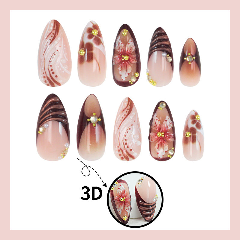 Kunstnagelset mit 3D-Blütenverzierungen und eleganten Mustern Brehn