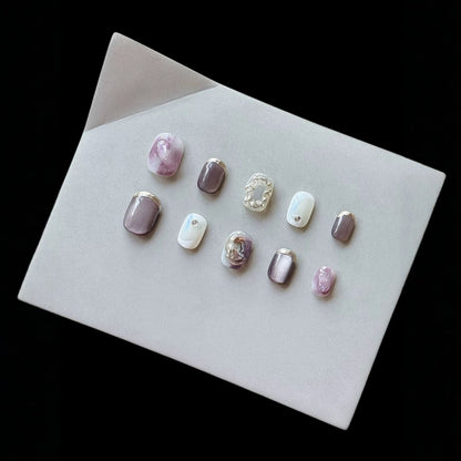 Künstlerisches Press-On Nagelkunst Set mit einzigartigen Ombre- und metallischen Akzenten